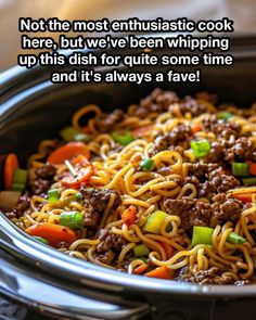 a bowl filled with noodles and meat on top of a table