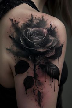 a black and white rose tattoo on the back of a woman's shoulder,