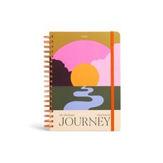 a spiral notebook with the words journey written on it and an image of a river running through