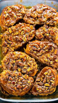 sweet potato casserole with pecans on top in a glass baking dish, ready to be eaten