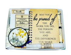 an open notebook with writing on it and some pens in front of the page that says, may you be proud of the work you do