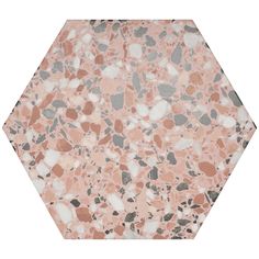 a hexagonal marble table top with pink and grey pebbles inlayed to it