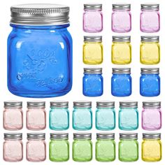 blue and yellow mason jars with lids are lined up in rows, all different colors