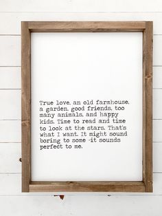 a wooden frame hanging on the wall with a poem written in it that reads true love, and old farmhouse