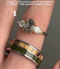 a woman's hand with two rings on it and the ring is made out of wood