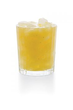 an orange drink in a glass with ice