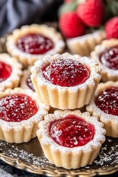 small tarts with raspberry filling on a plate