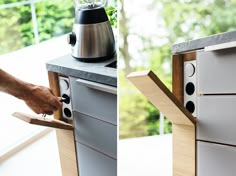 a person using a blender on top of an oven