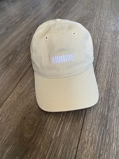 The embroidered Mombie dad hat has a classic unstructured fit with adjustable back.  Product Details:  .: 100% organic cotton .: 3/1 twill .: Unstructured .: 6 panel .: Matching sewn eyelets .: Self-fabric adjustable closure with a brass slider and hidden tuck-in Sizing:  .: Unisex Caps- One size fits all Shipping and Processing:  .: Production lead time  1-3 business days  .: Economy Shipping option arrives in 4-8 business days  .: Standard Shipping option arrives in 2-5 business days  *Please Funny Fall, Stylish Mom, Hat Embroidery, Embroidered Hat, Embroidered Baseball, Dad Cap, Panel Hat, Embroidered Baseball Caps, Embroidered Hats