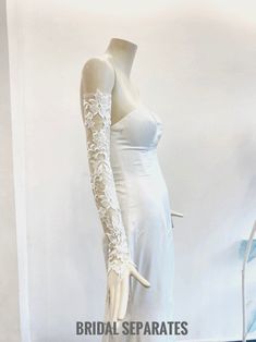 a white dress on display in a store window with the words bridal separates