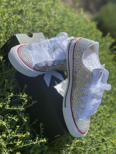 Custom Bling Converse All Star Chuck Taylor Sneakers. All designs handmade and embellished with a variety of high quality crystals. Great for weddings, proms, homecomings, birthdays, special events or just your everyday girly girl. Shoe Size: WOMEN'S size 5 to size 12 Size availability may vary based on our suppliers current inventory. If your size is out of stock at the time of your order we will notify you within 48 hours. ** PLEASE NOTE CONVERSE CHUCK TAYLOR SNEAKERS RUN ABOUT A WHOLE SIZE BI White All Star, Bride Maids, Bling Converse, Ribbon Shoes, Converse Women, Low Top Converse, Star Converse, Custom Bling, All Stars Converse