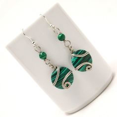 These handmade wire wrapped malachite arrings unique piece you are holding was made by hand especially for you... These silver earrings are simply stunning and perfect for livening up an everyday outfit. I can offer matching necklace and bracelet. My other pieces here: https://www.etsy.com/shop/BeyhanAkman My malachite arrings is coated with a durable clear non-toxic polymer to prevent tarnishing and oxidation formation. You'll receive this in a lovely gift wrapped box. I can include a handwritt Jewelers Workbench, Green Stone Earrings, Malachite Earrings, Malachite Bracelet, Big Ears, Lapis Lazuli Bracelet, Jewerly Beads, Earrings Wire, Christmas Gift For Mom