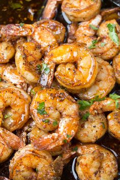 grilled shrimp with parsley in a skillet