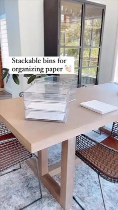 stackable bins for organizing paper on top of a table in a living room