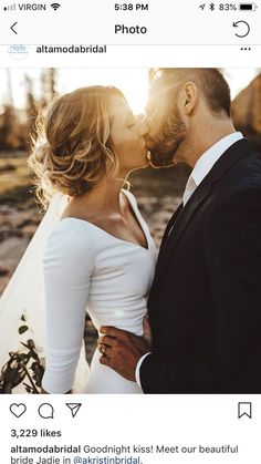 a man and woman kissing each other in front of the camera on their wedding day