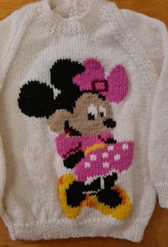 a knitted sweater with minnie mouse on it