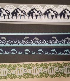 four different types of decorative paper with dolphins and mountains in the background, one is blue