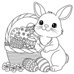 a cute bunny sitting next to an easter basket