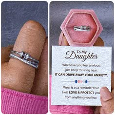 a woman's hand holding a ring with the words to my daughter on it