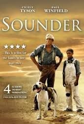 the movie houndder has two men standing next to each other and one dog on his lap