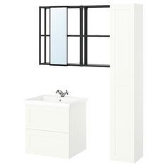 a white sink and mirror next to a tall black framed window with bars on it