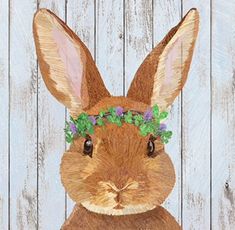 a brown rabbit with flowers on its head and the number twenty four painted on it's face