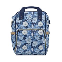 a blue and white flowered bag with two handles on the front, one handle is closed