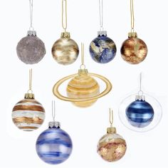 twelve glass baubles in various colors and sizes hanging from gold rings on white background