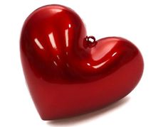 a red heart shaped object on a white background