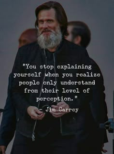 a man with a beard standing in front of a quote that reads, you stop explaining yourself when you really are people only understand from their level