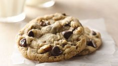 chocolate chip cookies are lined up on a table