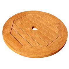 a round wooden cutting board on a white background