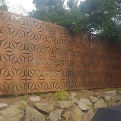 a stone wall with an intricate design on it