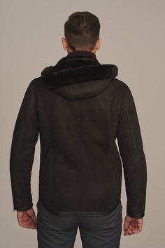 Short men's black sheepskin jacket made of delicate, natural lambskin. It has a stand-up collar and zippers at pockets and sleeves. Fastened with a zipper slightly shifted to the side. Men's sheepskin jacket with a detachable hood with a sporty character designed for people who do not like hats. Type of material: 100 % shearling Length: 73 cm Fastening: Zipper Care tips: Special cleaning of leather products Model's height: Our model is 186 cm tall and wears size 52 You can find other models of sheepskin coats at: https://andrzejkonopka.pl/main-eng.html Ask for a product: sklep@andrzejkonopka.pl Measuring instruction:   You should measure oneself and compare your measurements with table of sizes in order to set the perfect size, which is necessary for order. You should stay in straight posi Hooded Sheepskin Outerwear With Faux Fur Trim, Hooded Outerwear With Faux Fur Trim And Sheepskin, Sheepskin Hooded Outerwear With Faux Fur Trim, Hooded Outerwear With Faux Fur Trim In Sheepskin, Sheepskin Leather Jacket With Fleece Lining For Fall, Fall Sheepskin Leather Jacket With Fleece Lining, Hooded Sheepskin Outerwear With Fleece Lining, Hooded Shearling Outerwear With Faux Fur Lining, Fall Sheepskin Fur Coat With Fleece Lining