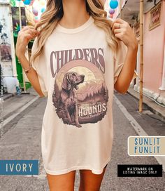 Finish off your country concert outfit with our unique Childers Hounds Shirt, featuring an original graphic inspired by his music lyrics. Crafted on Comfort Colors, this tee combines style and comfort for the perfect addition to your Childers Tshirt Merch collection. Retro T-shirt For Summer Country Concerts, Sublimation Print Tops For Summer Concert, Summer Tops With Sublimation Print For Concerts, Crew Neck T-shirt For Country Concerts, Crew Neck T-shirt For Country Concerts And Festivals, Summer Fan Merchandise Front Print Tops, Summer Fan Merchandise Top With Front Print, Retro T-shirt For Country Concerts In Summer, Summer Concert Top With Front Print