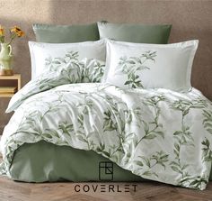 the comforter is made up with green leaves