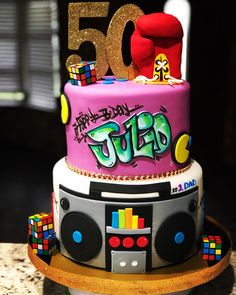 a birthday cake with the number 50 on top and an image of a dj's head