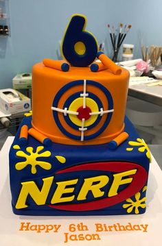 a birthday cake that is shaped like a nerf box