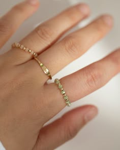 Crystal bead ring ✨Made with high polished gold filled beads on a comfy stretchy elastic band.This ring will be the perfect addition to your ring stack!Green or light Coral AB beadsPerfect for stacking or wearing it alone as a everyday ring!• Available in sterling silver, gold filled.• Round beads on a stretch cord• First sample picture if layered with 3 rings Homemade Jewelry Rings, Matching Beaded Rings, Cord Bracelet Diy, Jewelry Redesign, Jewelry Homemade, Stretch Rings, Hand Jewelry Rings, Elastic Rings, Diy Beaded Rings