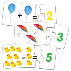 three cards with numbers and two rubber ducks holding umbrellas, one is missing the number