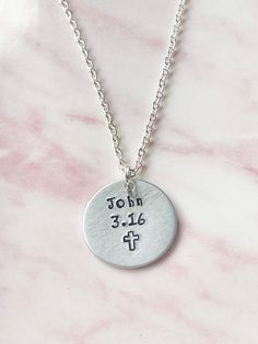 "FEATURES: * The necklace is available with either a silver plated or a sterling silver chain and in various lengths. You can make your selection from the drop down menu. * The aluminium disc measures 25mms (1 inch) in diameter and is hand stamped with John 3.16 and a cross symbol. * John 3.16 - \"For God so loved the world, that he gave his only begotten Son, that whosoever believeth in him should not perish, but have everlasting life.\" * Comes packaged on card inside a clear cello sleeve in a Inspirational Silver Necklace For Father's Day, Inspirational Silver Jewelry For Father's Day, Inspirational Silver Jewelry For Memorials, Inspirational Silver Jewelry For Memorial, Customizable Inspirational Silver Jewelry, Inspirational Customizable Silver Jewelry, Meaningful Customizable Silver Necklace, Inspirational Silver Jewelry For Birthday, Inspirational Engraved Silver Charm Necklaces