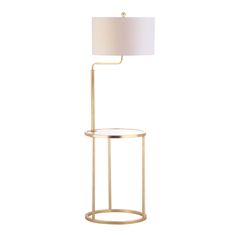 a gold metal floor lamp with a white shade on the base and a round glass table top