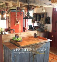 an old fashioned kitchen with lots of hanging pots and pans