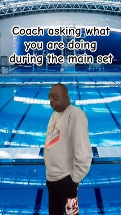 a man standing in front of a swimming pool with the caption coach asking what you are doing during the main set