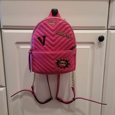 Nwot Victoria Secret Bright Pink Mini Book Bag Purse With 3 Cute Metal Emblems With "Victoria" On Each One. Measures 9 X 7 1/2 X 4 Inches. Take It Out Anywhere And Holds Everything! Cute Black Striped Inside Lining With Pocket Inside With Pink Lined Trim. Front Pocket With Zipper. Gold Chain On Adjustable Straps. I Also Have The Matching Wallet / Wristlet / Clutch! See Last Pic, Sold Under Seperate Listing, Not Included Here :). Let Me Know If You Want A Special Deal On Bundling! Victoria Secret Backpack, Beach Backpack, Boho Backpack, Studded Backpack, Bloxburg Decals, Faux Leather Backpack, Wallet Wristlet, Convertible Backpack, Mini Book