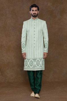 Pista green sherwani featuring sequin, thread, bead work handwork all over with stripe pattern. Paired with a bottle green churidar and an embellished hem dupatta. - Aza Fashions Fitted Green Churidar With Intricate Embroidery, Pista Green Zari Work Kurta For Reception, Pista Green Kurta With Zari Work For Reception, Green Churidar With Intricate Embroidery For Reception, Bollywood Style Semi-stitched Sherwani With Mirror Work, Green Kurta With Intricate Embroidery For Reception, Green Churidar With Intricate Embroidery For Transitional Season, Green Bandhgala With Dabka Work For Transitional Season, Fitted Pista Green Traditional Wear With Zari Work