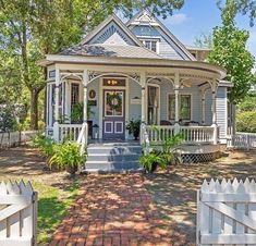 a house with a white picket fence around it