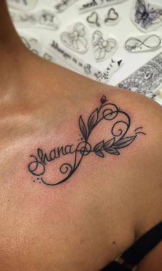 a woman with a tattoo on her shoulder that says mama and has leaves in it