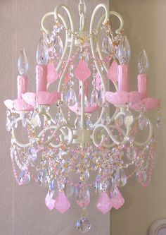 a pink chandelier hanging from the ceiling