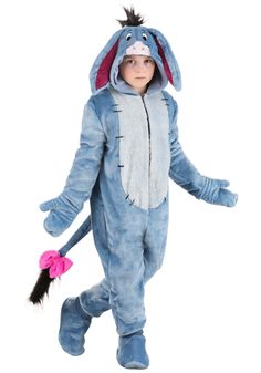 a little boy dressed in a blue bunny costume with pink ears and tail, holding a toy